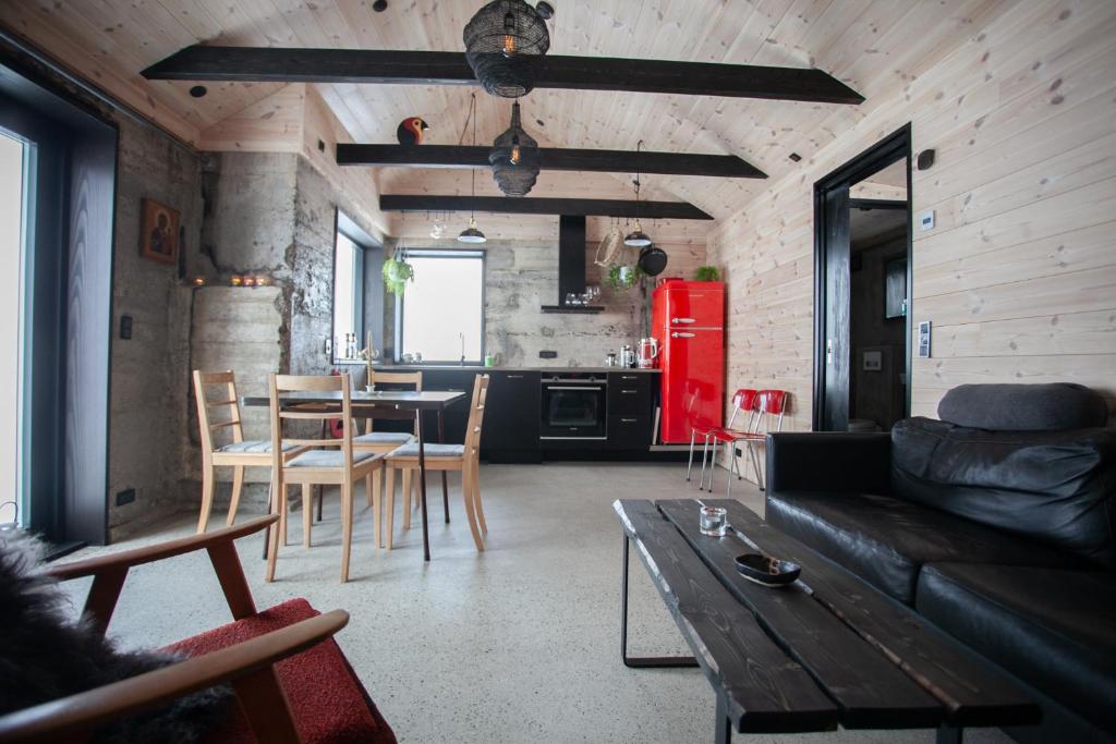 a living room with a couch and a table at Luxury Cottage in Tórshavn in Tórshavn