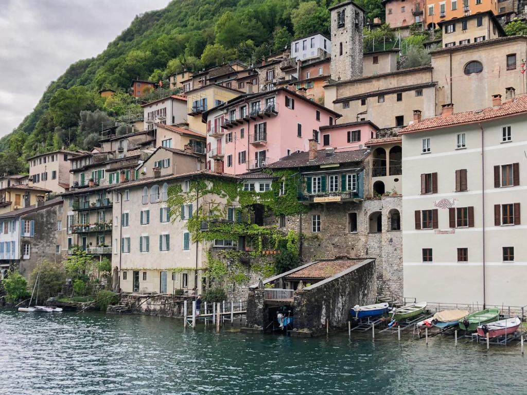 a town on the side of a river with houses at Locanda Gandriese in Gandria