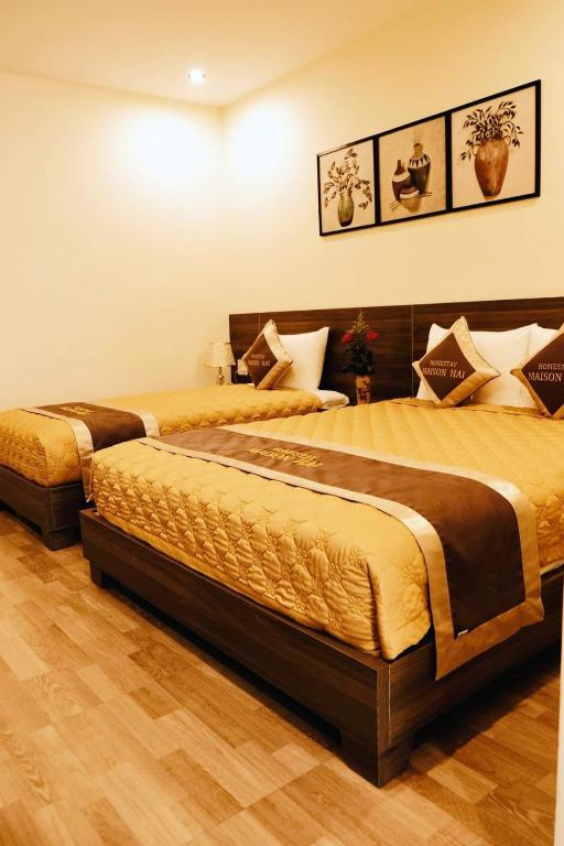 Giường trong phòng chung tại Maison Hai Homestay Hoi An