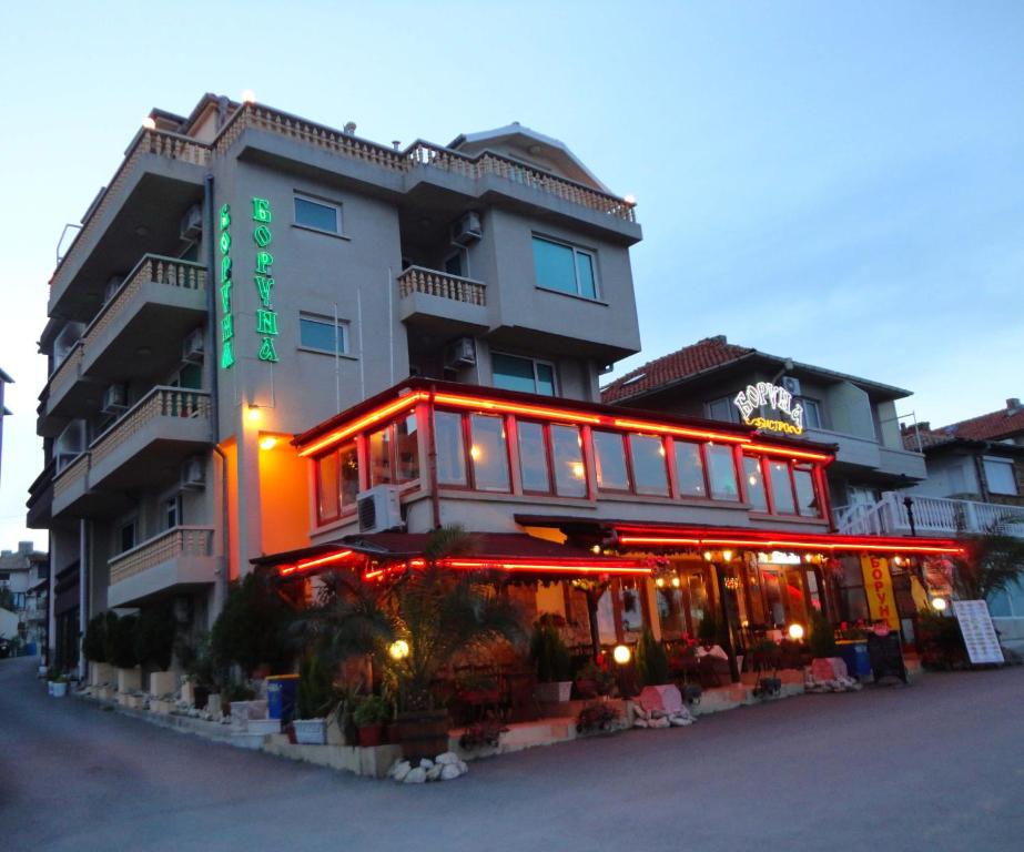 a building with red lights in front of it at Boruna Guest House in Sozopol