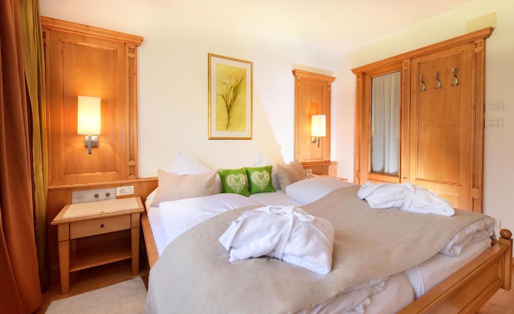 Postel nebo postele na pokoji v ubytování Hotel Brunnerhof