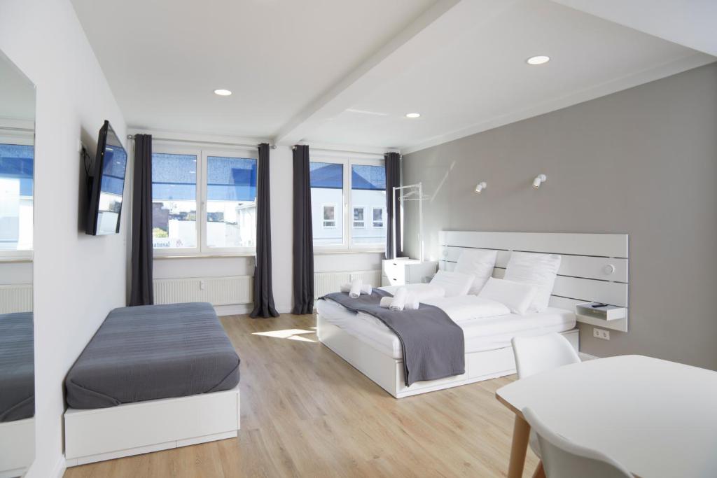 Postel nebo postele na pokoji v ubytování Hamburg Nord Apartments