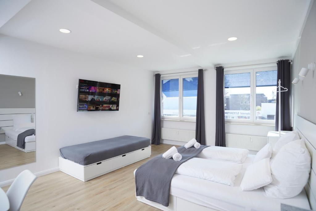 TV a/nebo společenská místnost v ubytování Hamburg Nord Apartments