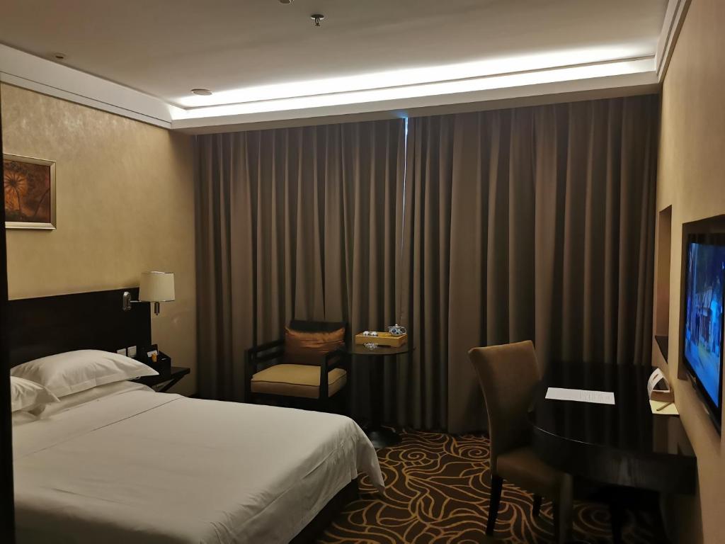 TV a/nebo společenská místnost v ubytování Hua Shi Hotel