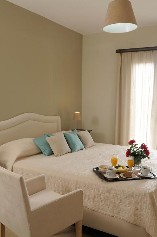Postel nebo postele na pokoji v ubytování Athena Hotel