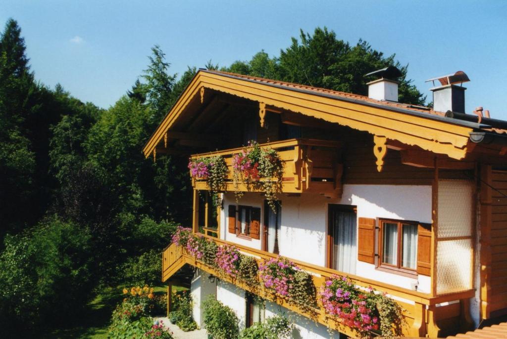 a house with flower boxes on the side of it at Gerlindes Haus - inkl. Chiemgau-Karte in Siegsdorf