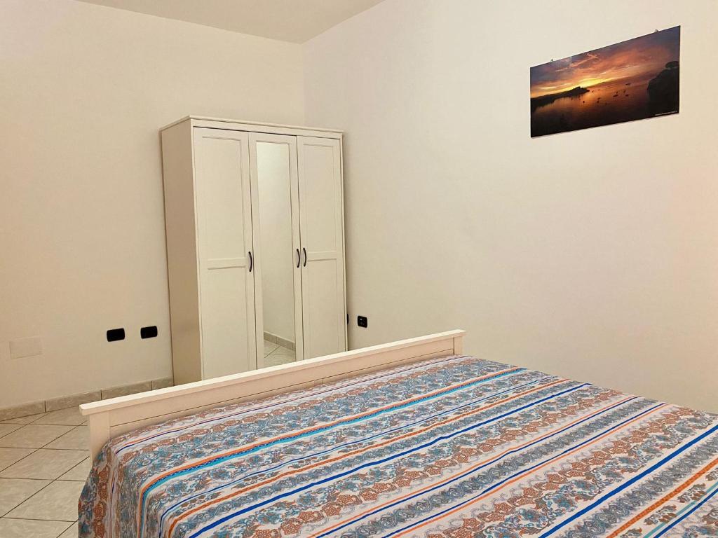Postel nebo postele na pokoji v ubytování Il Riccio Apartment
