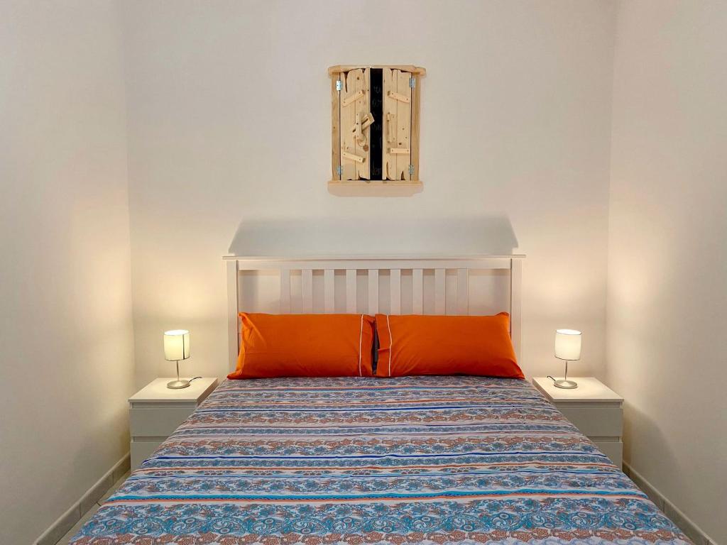 Postel nebo postele na pokoji v ubytování Il Riccio Apartment