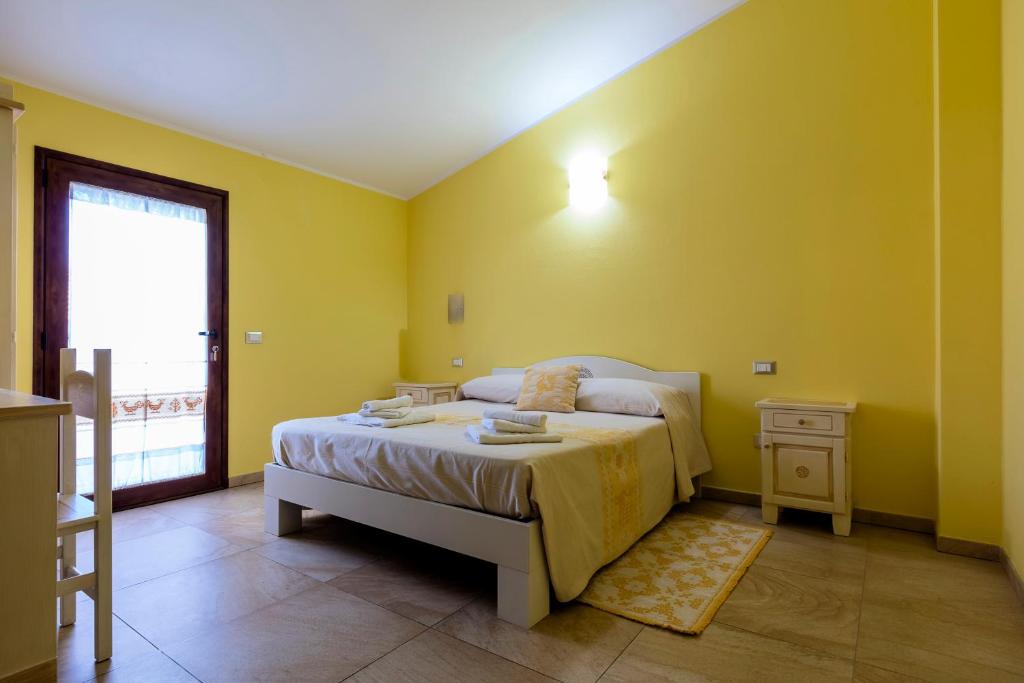 Postel nebo postele na pokoji v ubytování Sardinia for you