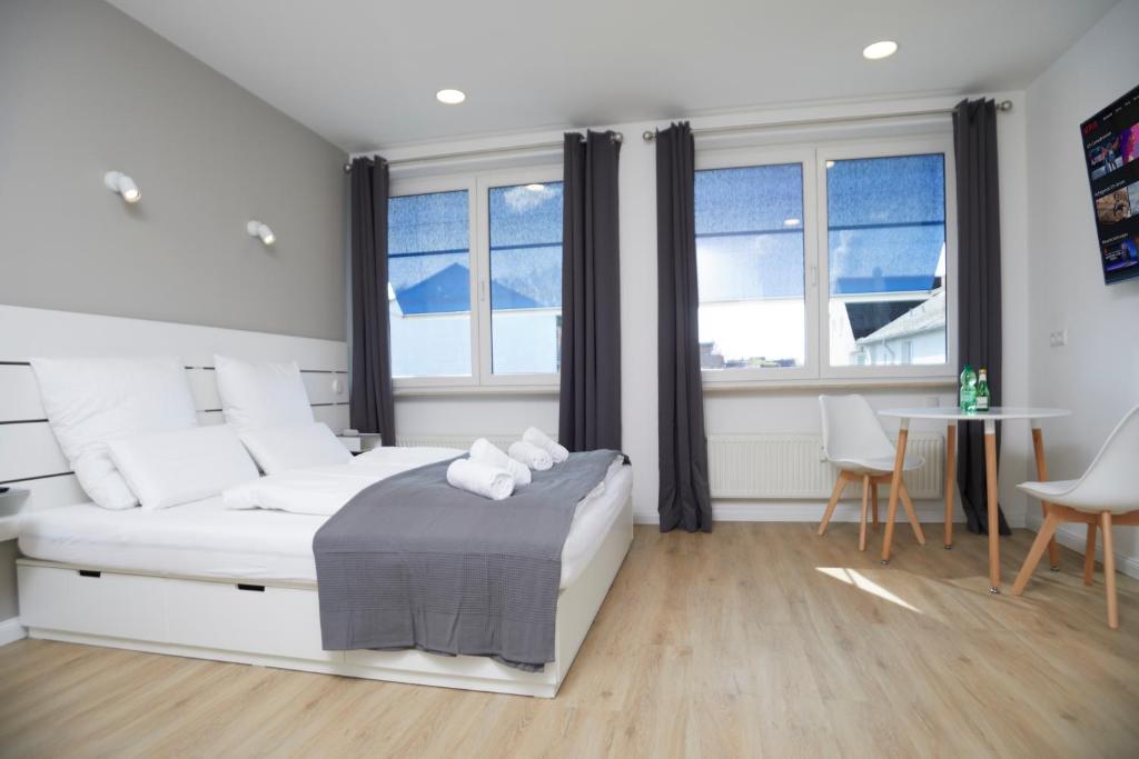 Postel nebo postele na pokoji v ubytování Hamburg Nord Apartments