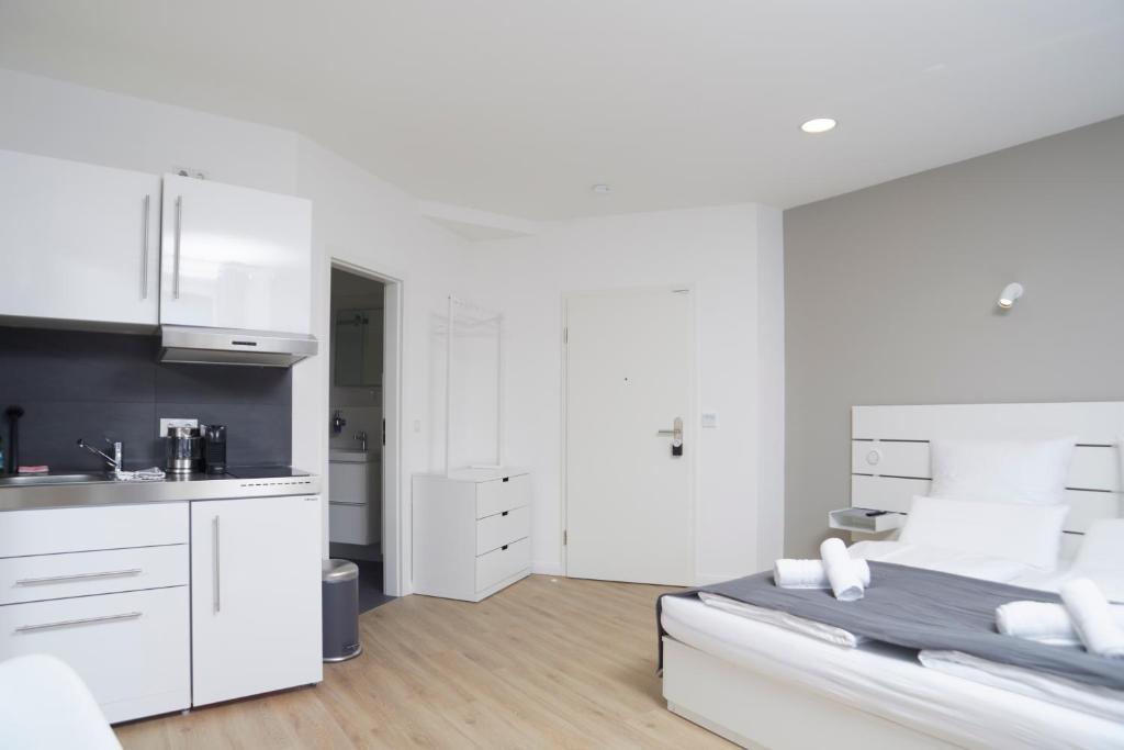Kuchyň nebo kuchyňský kout v ubytování Hamburg Nord Apartments
