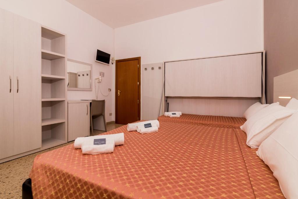 Postel nebo postele na pokoji v ubytování Hotel Lydia
