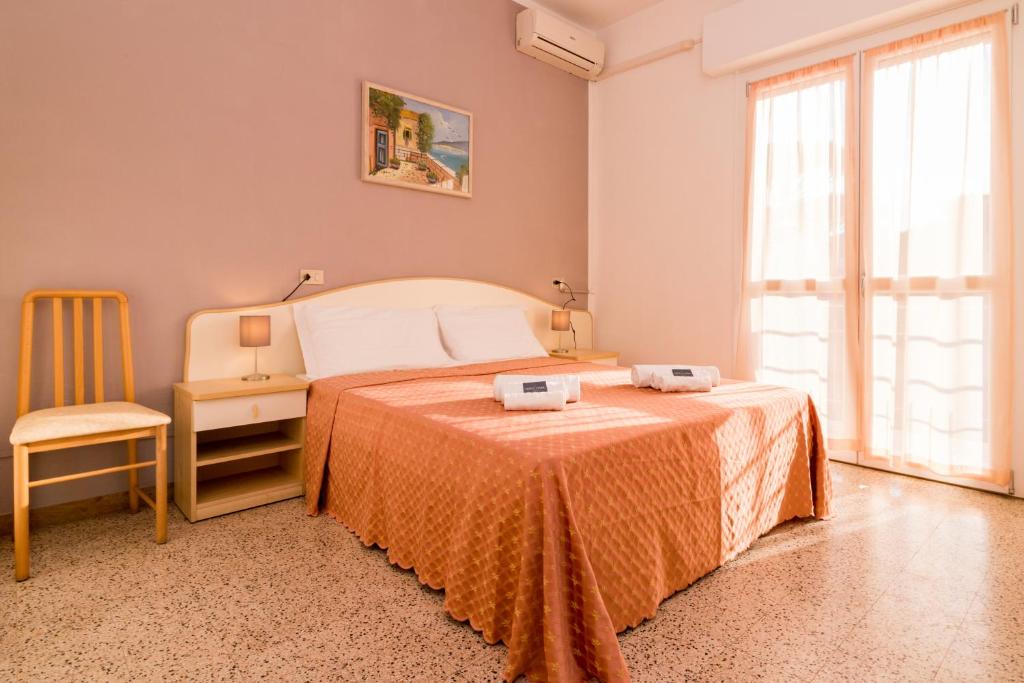 Postel nebo postele na pokoji v ubytování Hotel Lydia