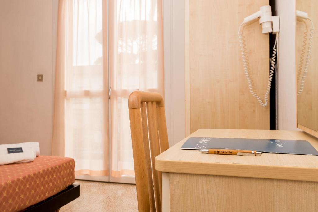 Postel nebo postele na pokoji v ubytování Hotel Lydia