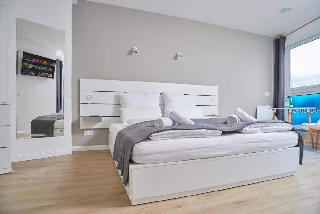 Postel nebo postele na pokoji v ubytování Hamburg Nord Apartments