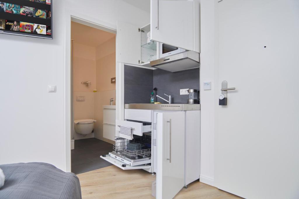 Kuchyň nebo kuchyňský kout v ubytování Hamburg Nord Apartments