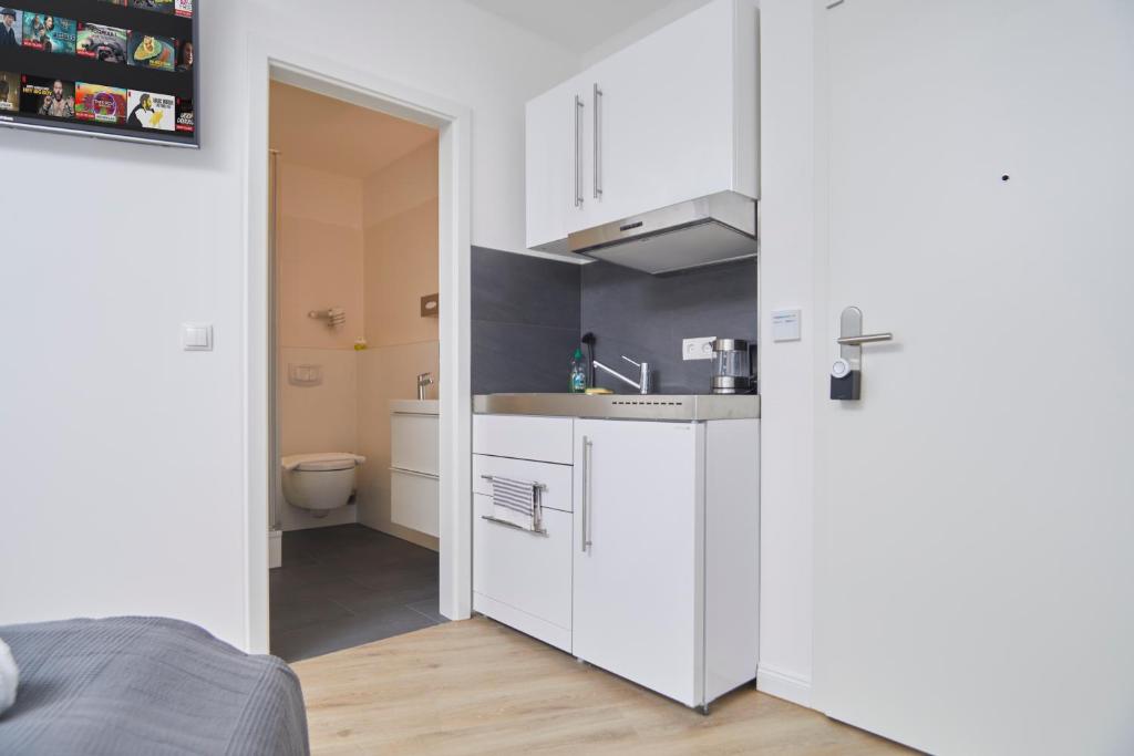 Kuchyň nebo kuchyňský kout v ubytování Hamburg Nord Apartments