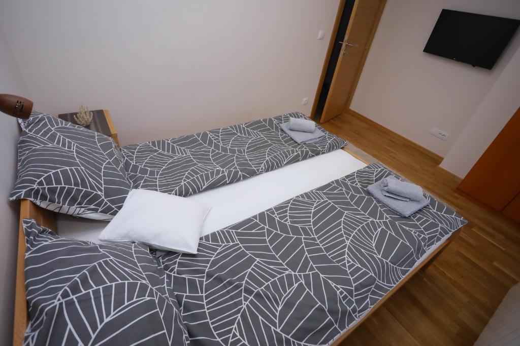 Postel nebo postele na pokoji v ubytování Mipet apartmani