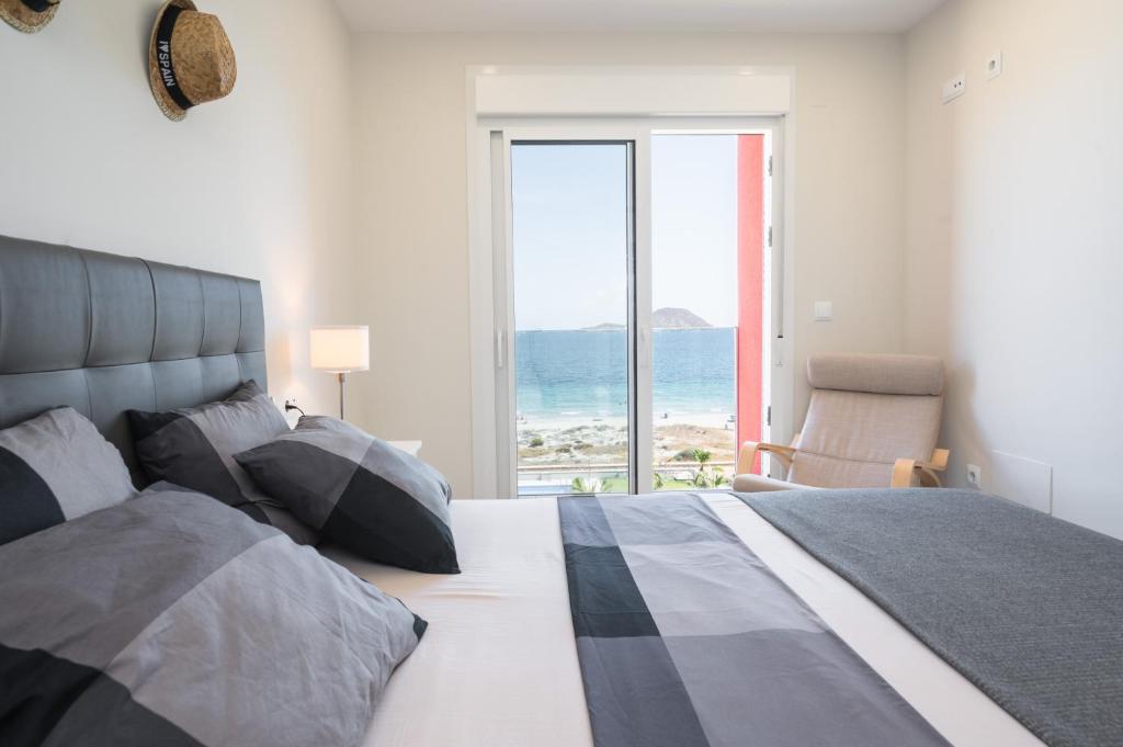 Postel nebo postele na pokoji v ubytování WONDER2SEA - Style & Comfort & Beach - LA MANGA