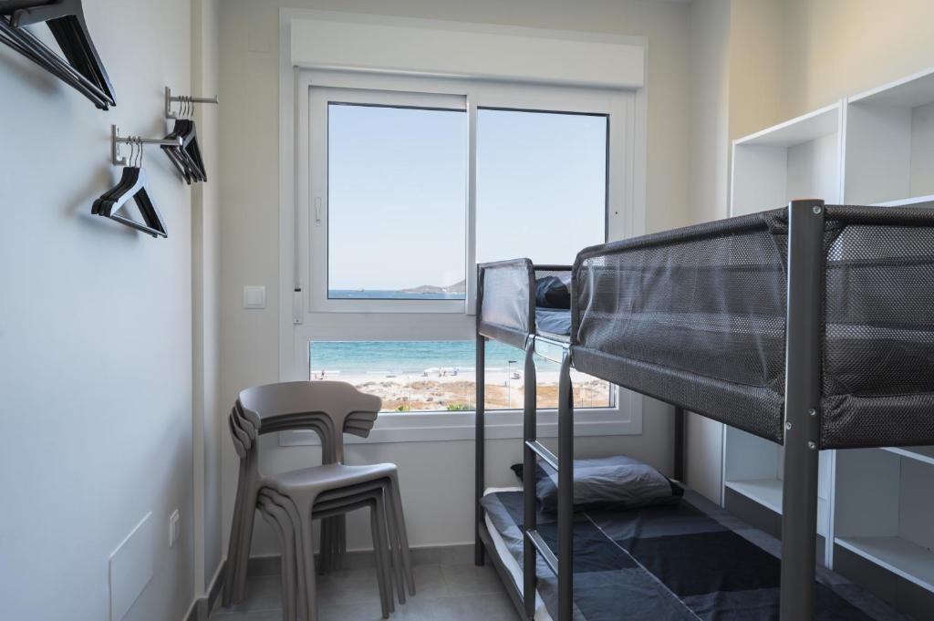 Postel nebo postele na pokoji v ubytování WONDER2SEA - Style & Comfort & Beach - LA MANGA