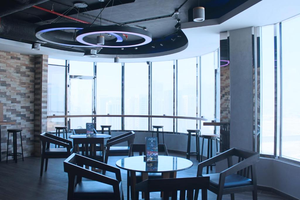 Un restaurante u otro lugar para comer en Al Diar Dana Hotel