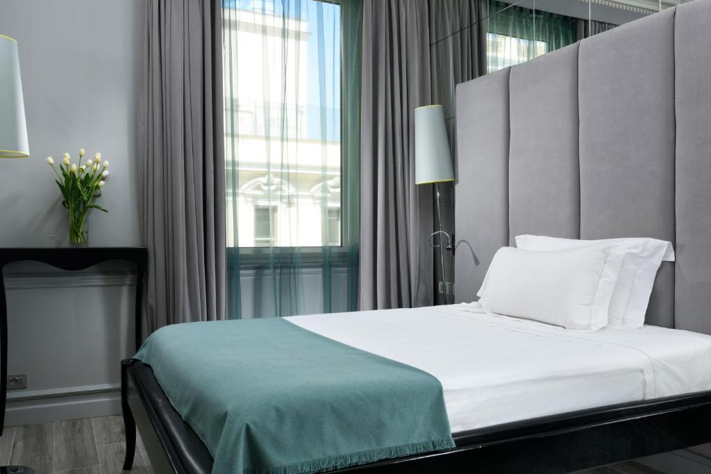 Posteľ alebo postele v izbe v ubytovaní Leon's Place Hotel In Rome