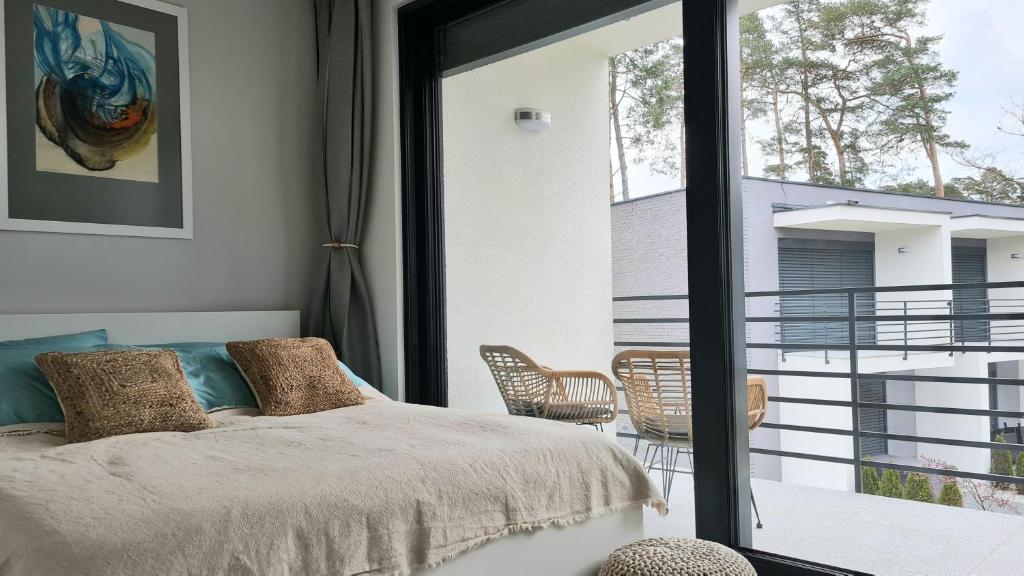 Posteľ alebo postele v izbe v ubytovaní AZURE Apartament Pobierowo