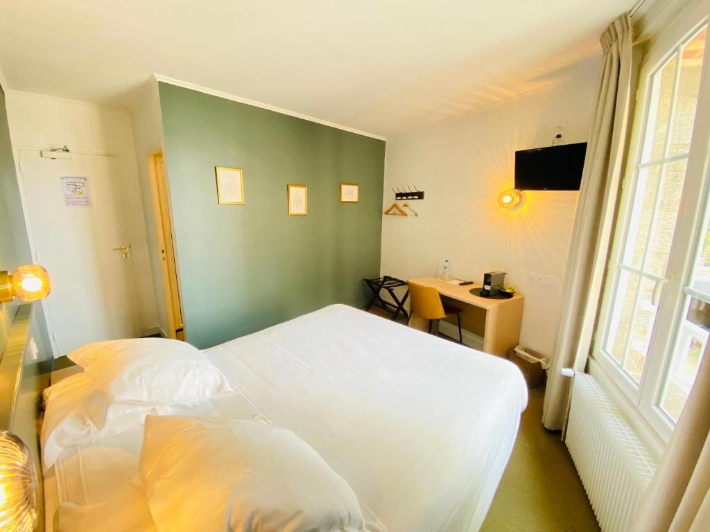 Postel nebo postele na pokoji v ubytování Hotel du Parc