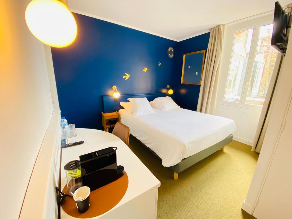 Postel nebo postele na pokoji v ubytování Hotel du Parc