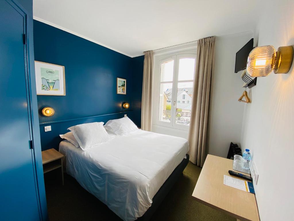 Postel nebo postele na pokoji v ubytování Hotel du Parc