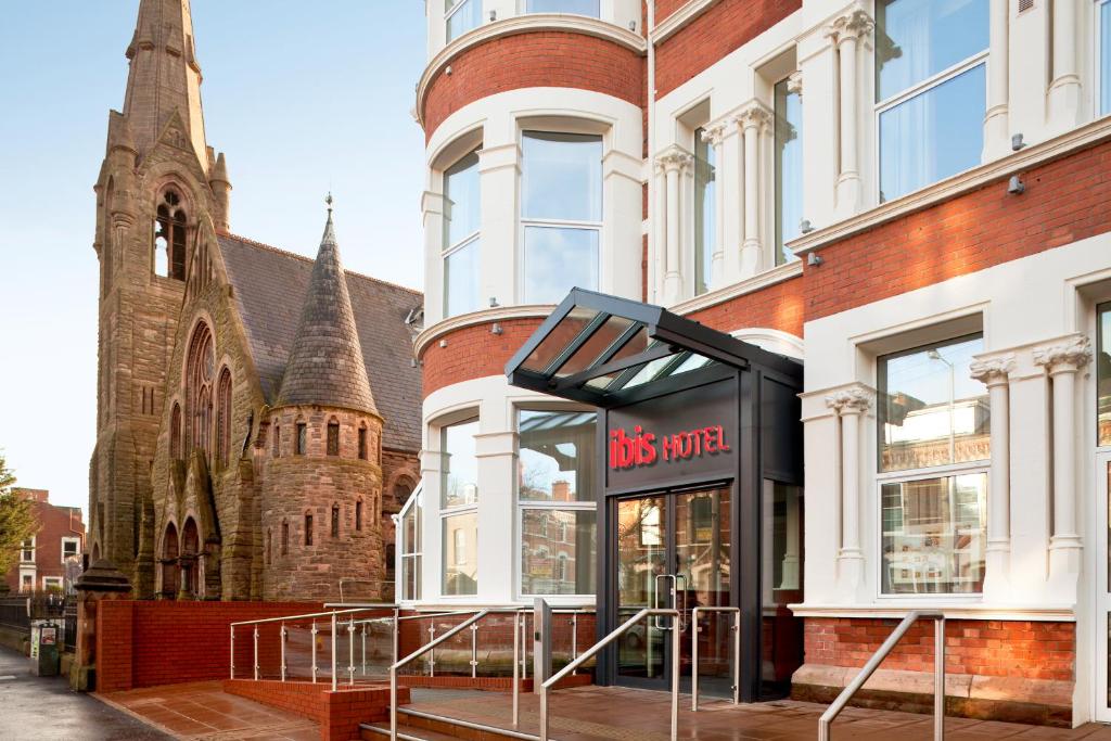 a bus stop in front of a church at ibis Belfast Queens Quarter in Belfast