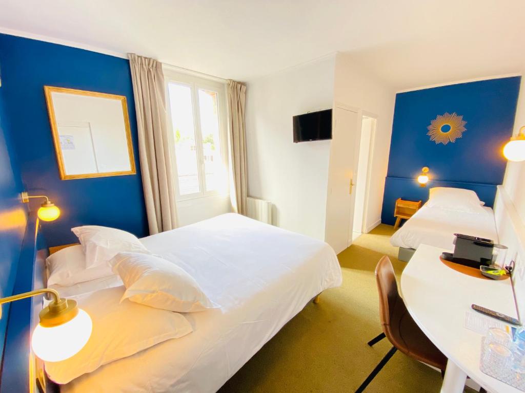 Postel nebo postele na pokoji v ubytování Hotel du Parc