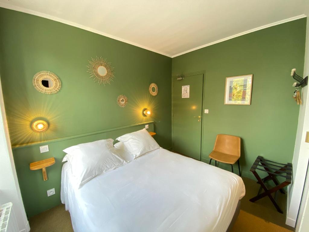 Postel nebo postele na pokoji v ubytování Hotel du Parc