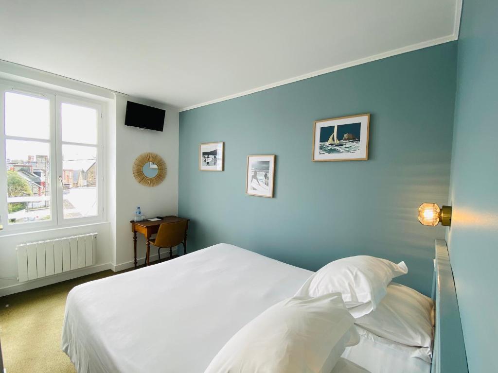 Postel nebo postele na pokoji v ubytování Hotel du Parc