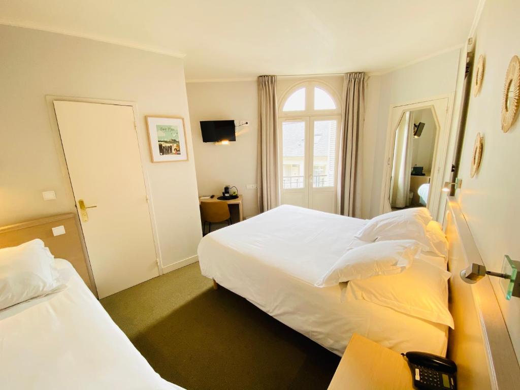 Postel nebo postele na pokoji v ubytování Hotel du Parc