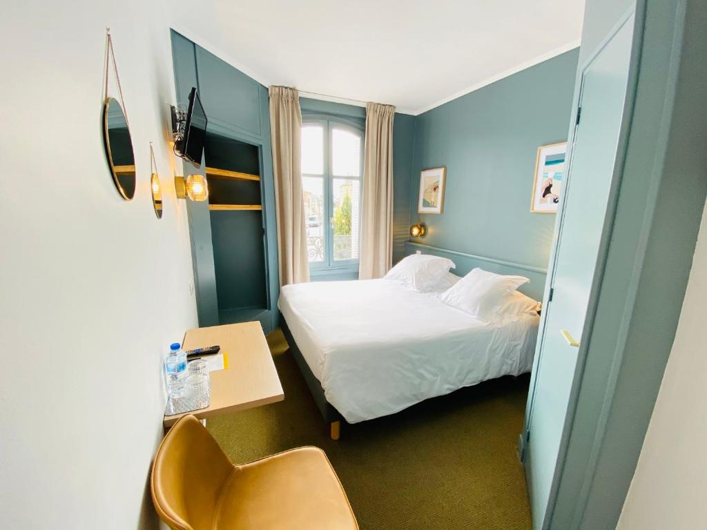 Postel nebo postele na pokoji v ubytování Hotel du Parc