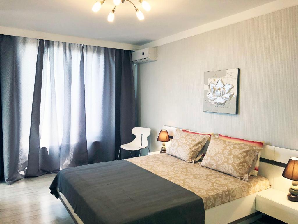 A bed or beds in a room at APART-HOTEL Stamopolu Lux с изглед към морето