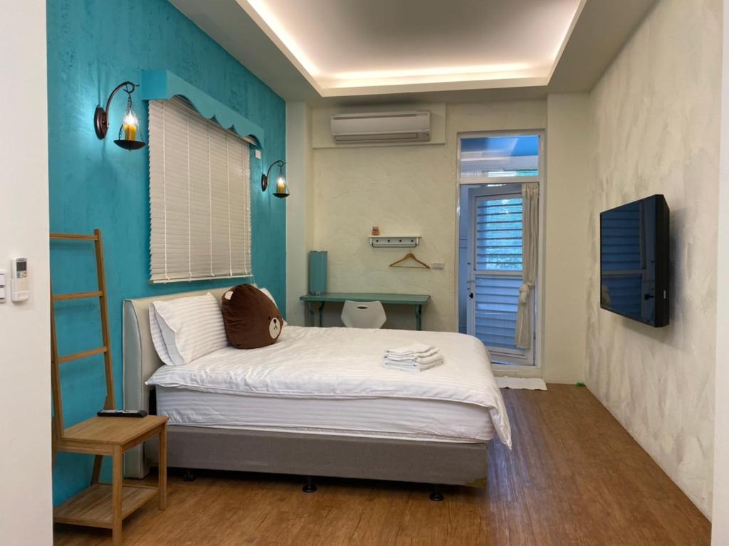 Katil atau katil-katil dalam bilik di Mu bank Villa 慕堤包棟休閒別墅