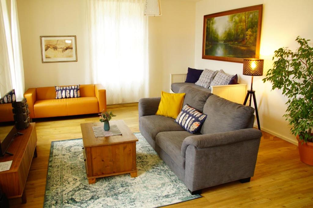 a living room with a couch and a table at Apartmány u komína in Terezín