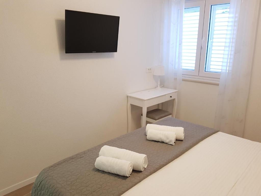 Postel nebo postele na pokoji v ubytování La Vista apartments