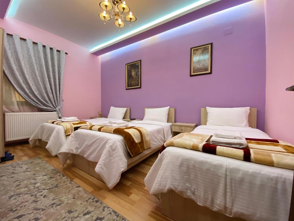 Postel nebo postele na pokoji v ubytování Vila A Hotel
