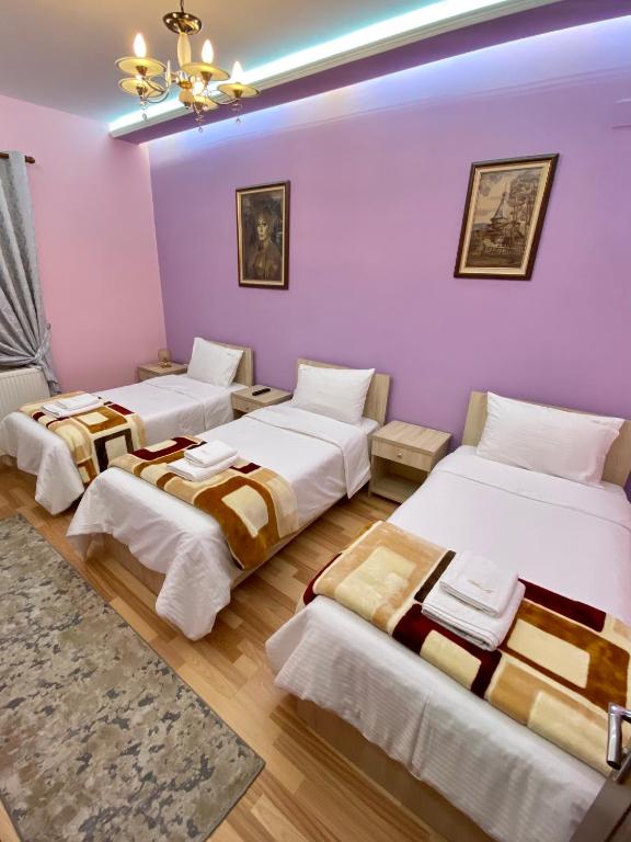 Postel nebo postele na pokoji v ubytování Vila A Hotel