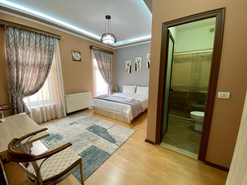 Postel nebo postele na pokoji v ubytování Vila A Hotel