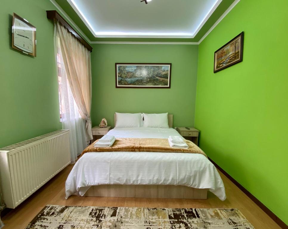 Postel nebo postele na pokoji v ubytování Vila A Hotel