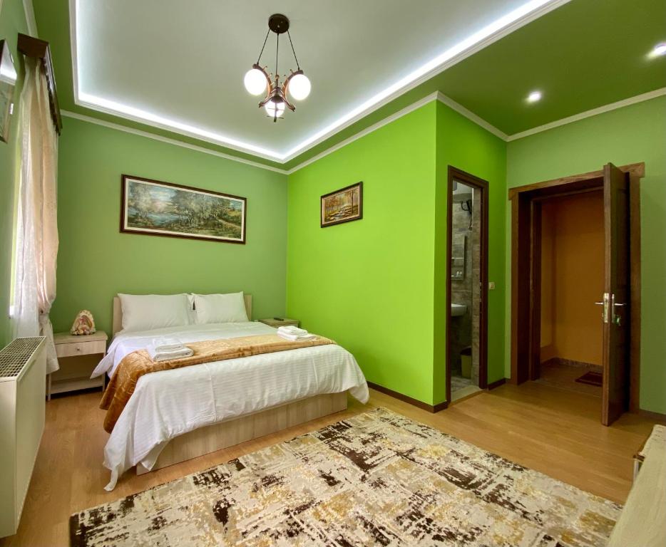 Postel nebo postele na pokoji v ubytování Vila A Hotel