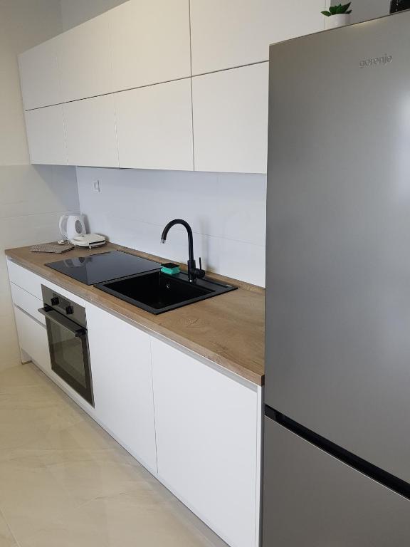 Kuchyň nebo kuchyňský kout v ubytování La Vista apartments