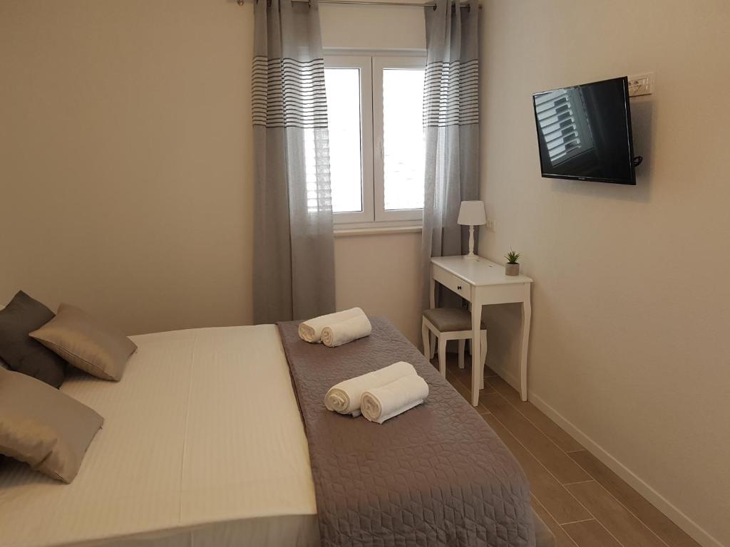 Postel nebo postele na pokoji v ubytování La Vista apartments