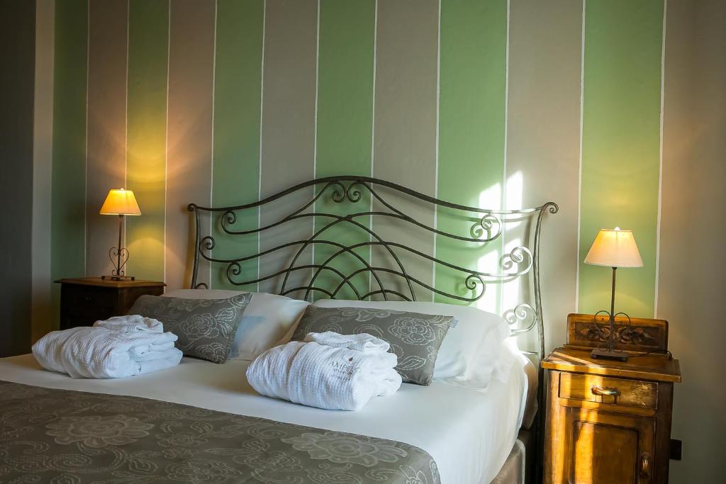 Postel nebo postele na pokoji v ubytování Agriturismo La Torricella