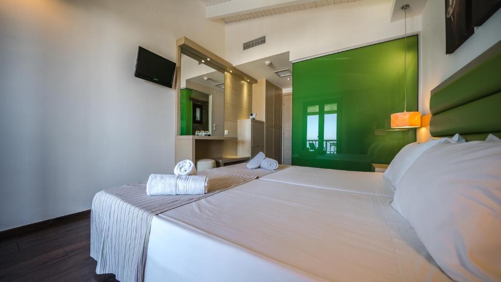 Postel nebo postele na pokoji v ubytování Forest Park Hotel
