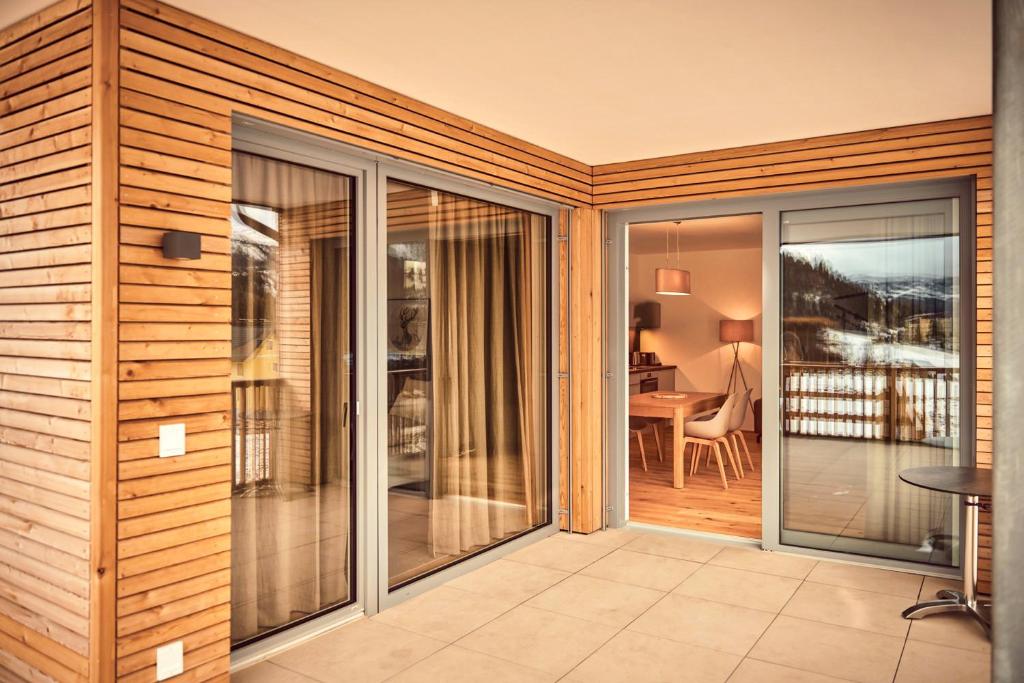 A balcony or terrace at Adler Lodge D3 by AA Holiday Homes